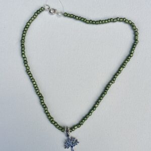 Small metallic green beaded necklace with a small silver tree of life pendent