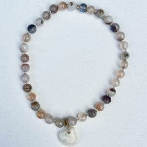 Medium beaded agate necklace, clear and gold divider beads with white iridescent shell pendent