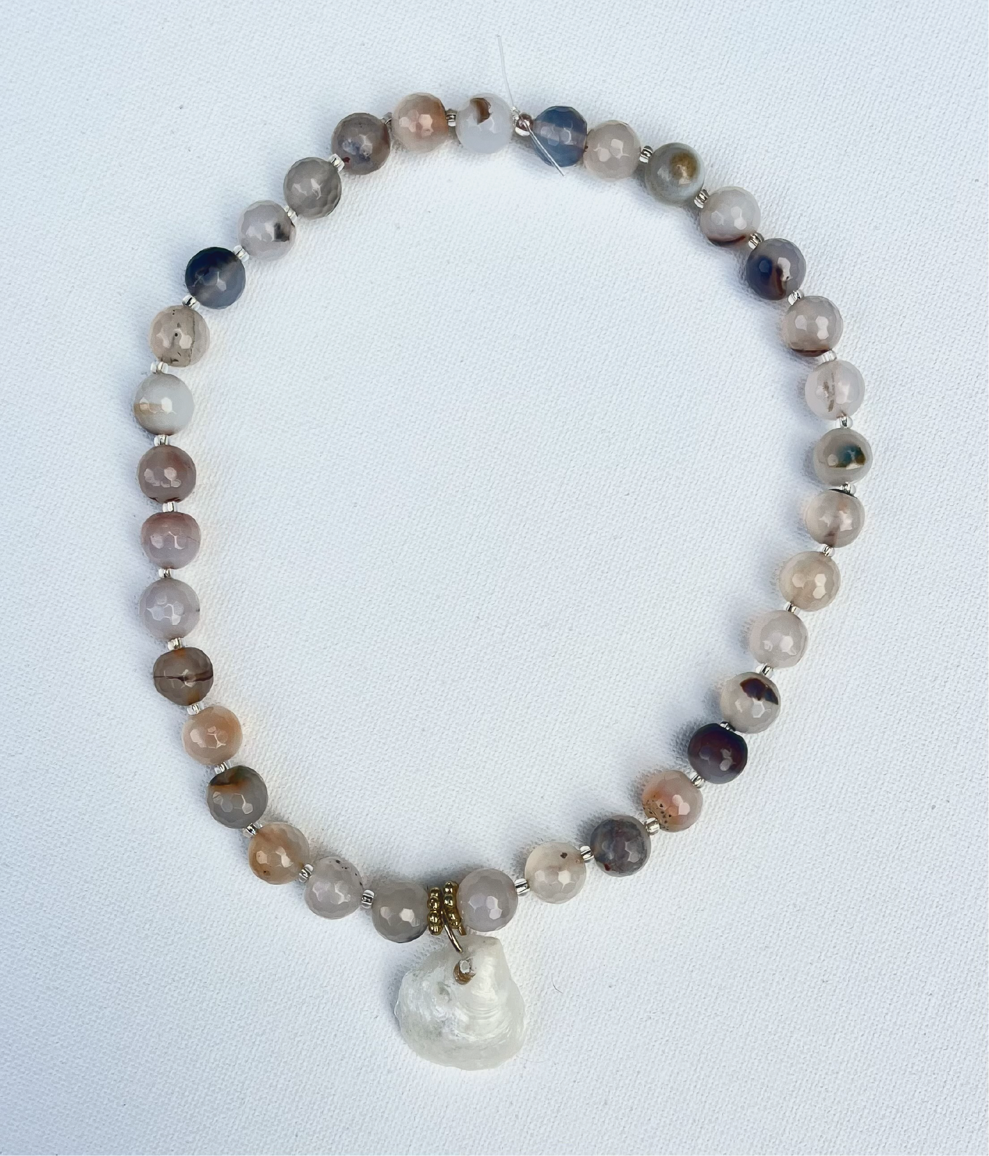 Medium beaded agate necklace, clear and gold divider beads with white iridescent shell pendent