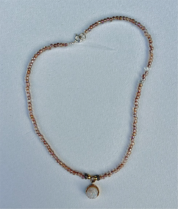 rose gold small beaded necklace with gold and white crystal pendant