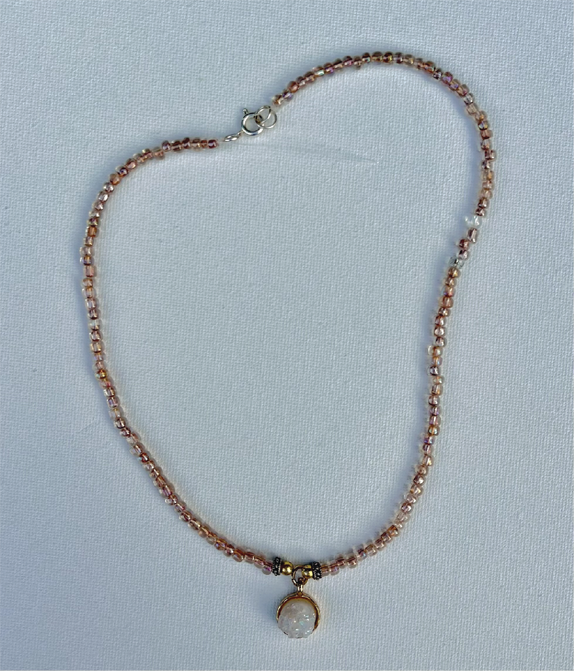 rose gold small beaded necklace with gold and white crystal pendant