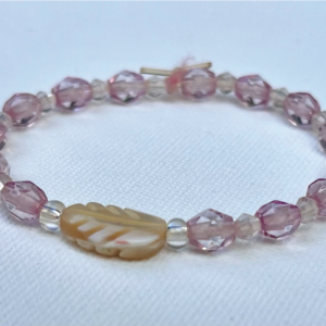 transparent lavender beads with palm leaf in center